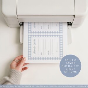 May include: A sheet of paper with two "Advice & Wishes" game templates, printed from a white printer. The templates have a light blue gingham border. The text "Print 2 games per 8.5 x 11" sheet at home" is in a blue circle.
