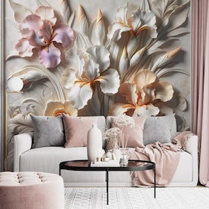 May include: A wall mural featuring large, three-dimensional sculpted iris flowers in shades of soft pink, cream, and white. The floral design is set against a textured, light-coloured background, creating a layered, relief-like appearance.