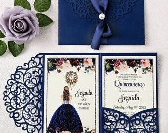 May include: Blue and white laser cut invitation with a floral design and a clock. The invitation is for a Quinceañera for Jezaida on Saturday, May 14, 2022.