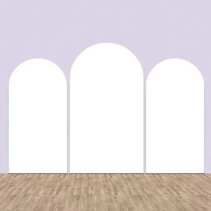 May include: Three white arches against a light purple wall with a wood floor.