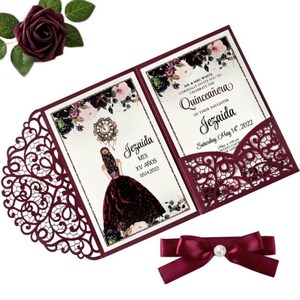 May include: Burgundy laser-cut invitation with a floral design and a pocket for a RSVP card. The invitation is for a Quincea&ntilde;era celebration for Jezaida on May 14, 2022.
