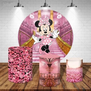 May include: Three pink and white themed backdrop stands with a pink and white Minnie Mouse backdrop in the background. The stands are decorated with pink roses, a pink and white castle scene, and a pink and white floral field.