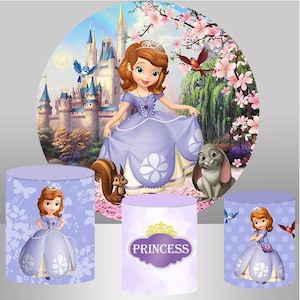 May include: A set of three purple and white themed party decorations featuring a cartoon princess in a purple dress. The decorations include a round backdrop with a castle and flowers, a cylinder with a princess and butterflies, and a cylinder with the word "Princess" in a purple frame.