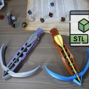 May include: Two 3D printed crossbows with a blue and purple color scheme. The crossbows are designed to hold dice and have a small arrow attached to the front. The image also includes a file icon labeled "STL" indicating that the crossbows are 3D printable.