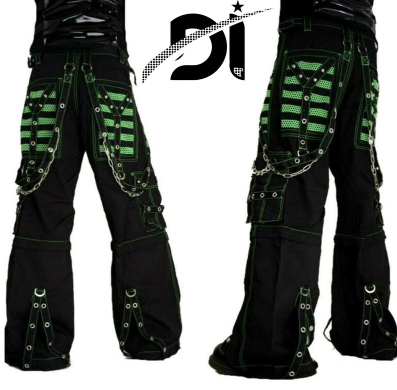 May include: Black cargo pants with green trim and multiple straps and buckles. The pants have a chain detail and a large pocket on each leg.