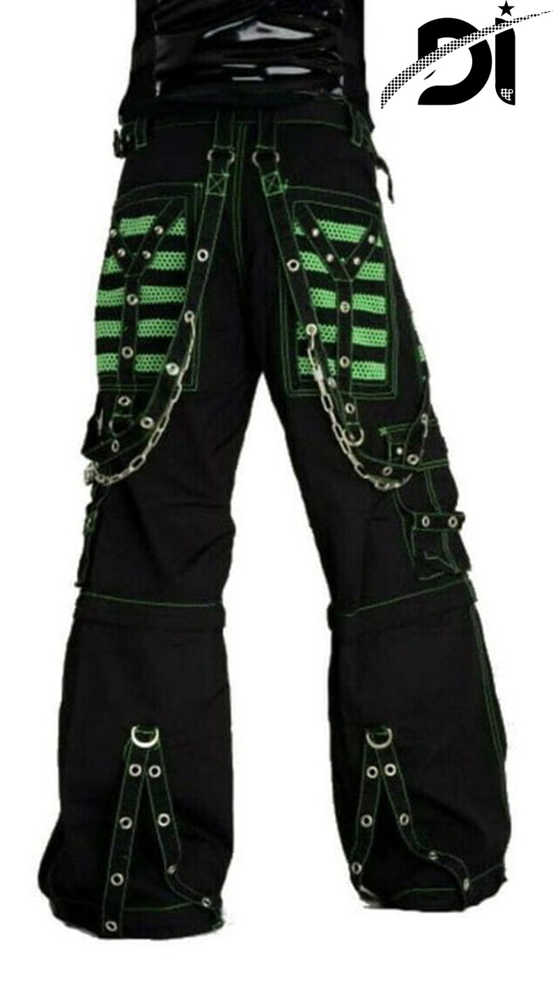 May include: Black cargo pants with green trim and silver chains. The pants have multiple pockets and buckles.