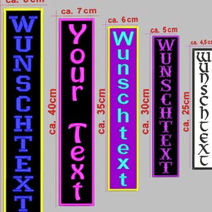 May include: A selection of rectangular patches in various sizes and colours, each featuring the German word "Wunschtext" or "Your Text" in different fonts. Sizes range from approximately 10 cm to 50 cm in height.