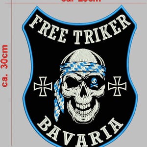 May include: A black and blue embroidered patch with the words "FREE TRIKER" and "BAVARIA". The patch features a skull wearing a blue and white checkered bandana and an eye patch with a skull and crossbones. The patch is approximately 12 inches tall and 10 inches wide.