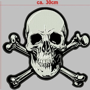 May include: A white skull and crossbones patch with black outlines. The skull has a detailed design with a black eye socket and teeth. The patch is approximately 30 cm wide and 27 cm tall.