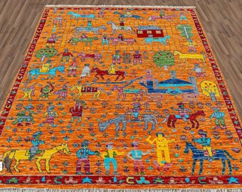 May include: A colorful rug with a repeating pattern of people riding horses and other animals. The rug has a bright orange background with red, blue, green, and yellow accents.