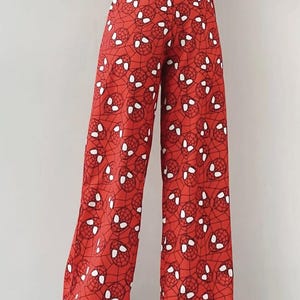 Red Wide Leg Pants with Comic Inspired Eye Print, High Waist, Loose Fit, Fun Streetwear Trousers, Cute Sleepwear for Comfortable Nights
