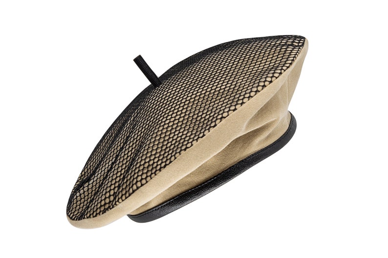 May include: A beige beret with a black mesh panel and a black leather trim.