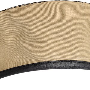 May include: A beige beret with a black leather band around the bottom edge.