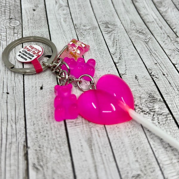 Porte-clés sucette rose vif avec breloques bonbons
