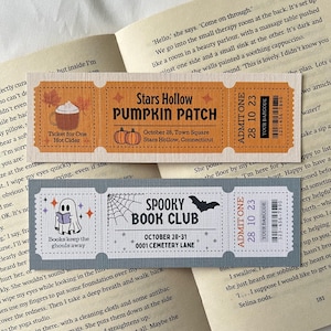 May include: Three vintage-style ticket stubs for a pumpkin patch, a spooky book club, and a hot cider stand. The tickets are orange, grey, and brown with black text and illustrations. The text on the tickets reads "Stars Hollow Pumpkin Patch", "Spooky Book Club", and "Ticket for One Hot Cider".