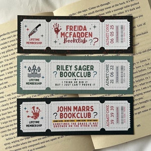 May include: Three colourful bookmarks with a ticket design. Each bookmark features a different book club name, "Freida McFadden Bookclub", "Riley Sager Bookclub", and "John Marrs Bookclub". The bookmarks have a black and white design with red, green, and yellow accents.