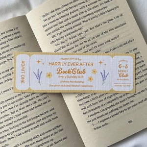 May include: A yellow and purple ticket with the text "Happily Ever After Book Club" and "Every Sunday 6-8" with a floral design. The ticket includes a lifetime membership and one drink is included.