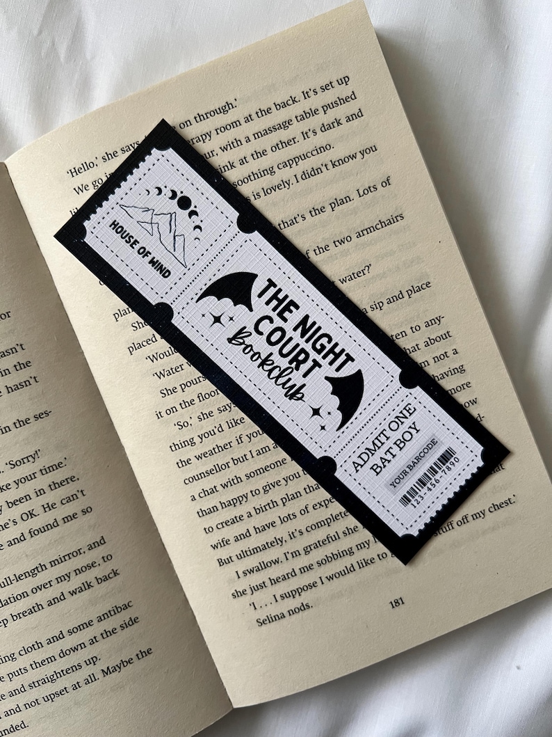 May include: Black and white bookmark with a bat design and the text "The Night Court Bookclub". The bookmark also features a smaller design with the text "House of Wind".