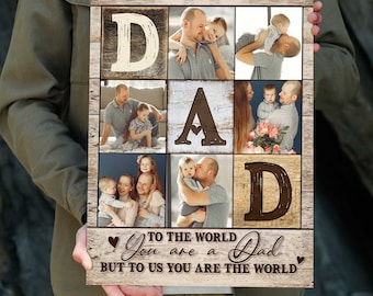 May include: Wooden photo collage with the word "DAD" spelled out in large letters. The letters are made of wood and are interspersed with family photos. The bottom of the collage reads "TO THE WORLD YOU ARE A DAD BUT TO US YOU ARE THE WORLD."