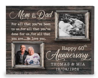 May include: A rustic wooden sign with two framed photos and a message that reads "Mom & Dad For all that you've been to us, for all that you've done for us, for all that you are...We love you. Happy 60th Anniversary THOMAS & MIA 12/04/1962"