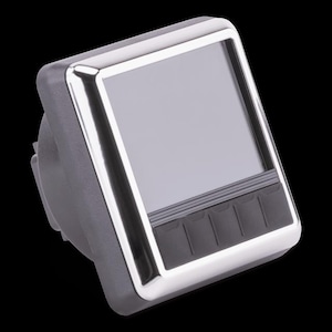 May include: A square, digital gauge with a silver bezel and a gray screen. The gauge has a dark gray body and a row of four black buttons at the bottom. The background is black.