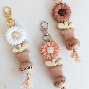 Porte-clés personnalisé Étiquette de sac de rentrée, Porte-clés en perles de silicone avec nom. Porte-clés fleur avec gravure. Fermeture éclair facile à tirer.