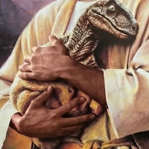 May include: A digital art print depicts a person in a cream-colored robe cradling a dinosaur. The dinosaur has a textured, gray head and a tan body. The person's hands are visible, holding the dinosaur close. The background is a soft, blurred wash of color.