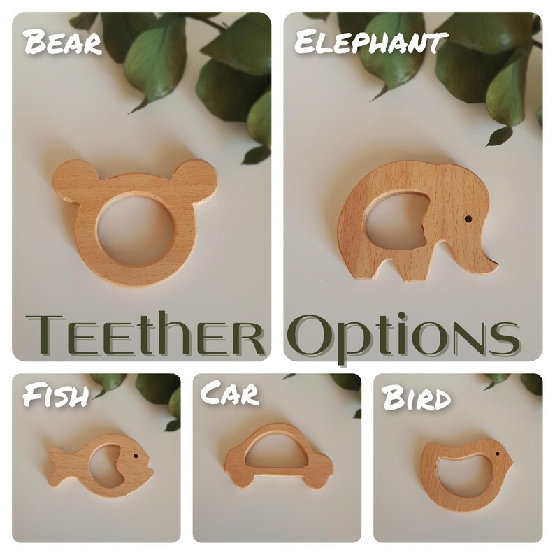 May include: Six wooden teethers shaped like a bear, elephant, fish, car, bird, and a blank option. The teethers are all natural wood color and have a smooth finish. "Teether Options" is written in green text below the teethers.