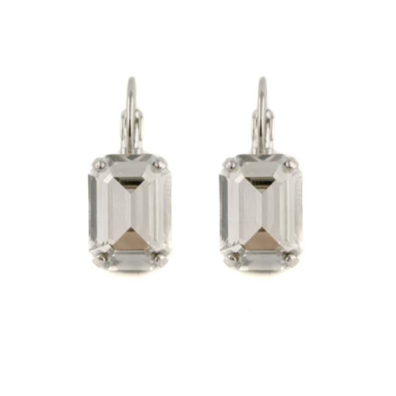 May include: A pair of silver earrings with clear emerald-cut crystal stones.