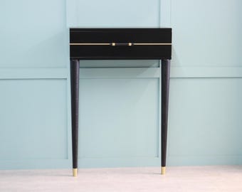 Consola de recibidor negra y dorada - Mesa auxiliar de entrada estilo art déco con un solo cajón.