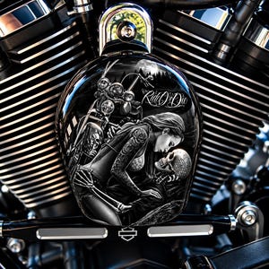 May include: A black and white motorcycle air cleaner cover featuring a detailed graphic of a person with tattooed arms embracing a skull. The text Ride Or Die is printed above the figures, set against a background of a motorcycle and forest.