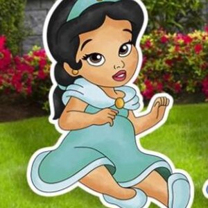 May include: A cartoon illustration of a baby character with dark hair, wearing a teal headband with a gold accent, a matching teal dress with a light blue collar, and gold shoulder clasps. The character has large brown eyes and light blue shoes.