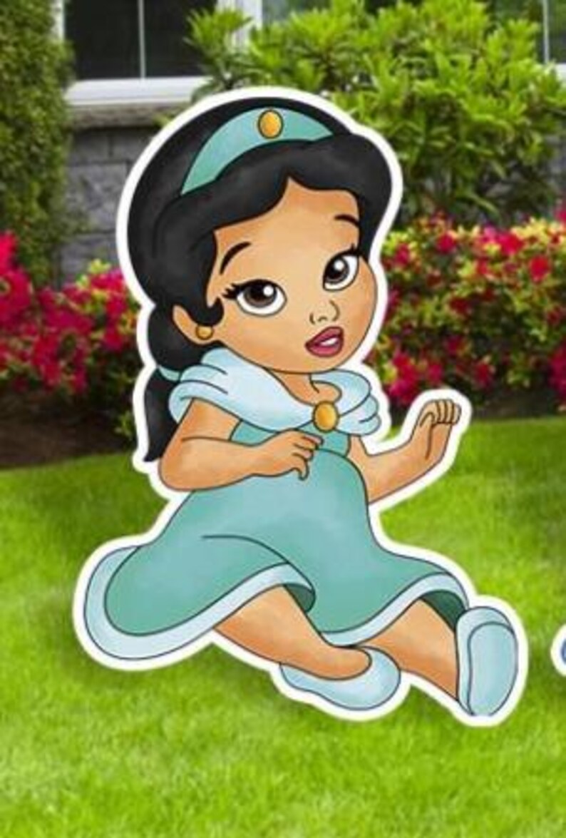 May include: A cartoon illustration of a baby character with dark hair, wearing a teal headband with a gold accent, a matching teal dress with a light blue collar, and gold shoulder clasps. The character has large brown eyes and light blue shoes.