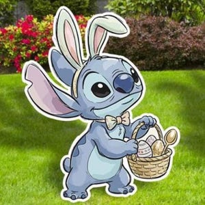 May include: A blue cartoon character with bunny ears and a bow tie, holding a basket of Easter eggs and a spoon. The character is standing on green grass, with bushes and trees in the background.