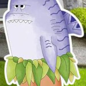 May include: A cartoon shark character with a grumpy expression. The shark is primarily light purple with darker purple stripes and a tribal design on its fin. It wears a grass skirt and has orange feet. The image is a yard decoration.