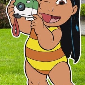 May include: A cartoon illustration of a young girl with long black hair wearing a yellow and orange striped swimsuit. She is holding a green and white camera in her right hand and smiling.