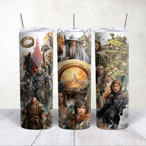 May include: Three stainless steel tumblers with a white background and colorful images of characters and scenes from the Lord of the Rings. The tumblers feature images of Gandalf, Frodo, Aragorn, Gollum, and the Shire.