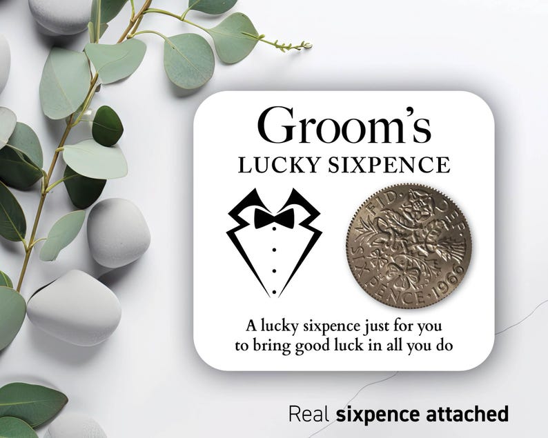 May include: A white card with the text "Groom's LUCKY SIXPENCE" and a tuxedo graphic. A vintage sixpence coin is attached. The text "A lucky sixpence just for you to bring good luck in all you do" is also included.