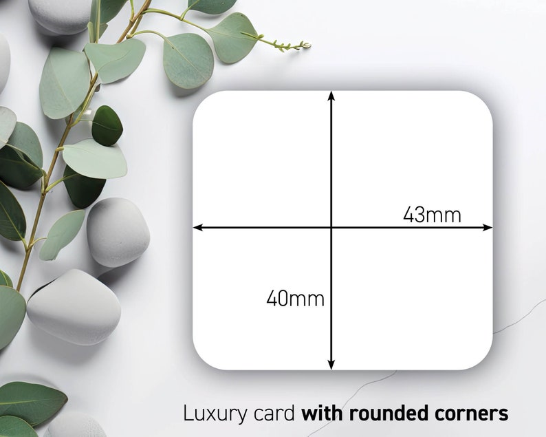 May include: A white luxury card with rounded corners, measuring 43mm by 40mm. The card's dimensions are indicated by black lines and measurements. The card is set against a backdrop of green leaves and white stones.