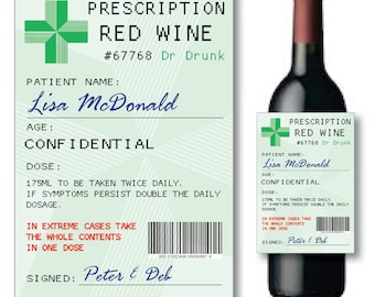 May include: A green and white prescription label for red wine with the text "Prescription Red Wine #67768 Dr Drunk" and "Patient Name: Lisa McDonald" and "Age: Confidential" and "Dose: 175ml to be taken twice daily. If symptoms persist double the daily dosage. In extreme cases take the whole contents in one dose. Signed: Peter & Deb". A bottle of red wine with a similar label.