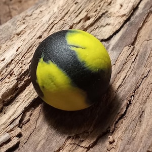 Yellow and black bubble bee colored sea glass marble perfectly weathered by the ocean
