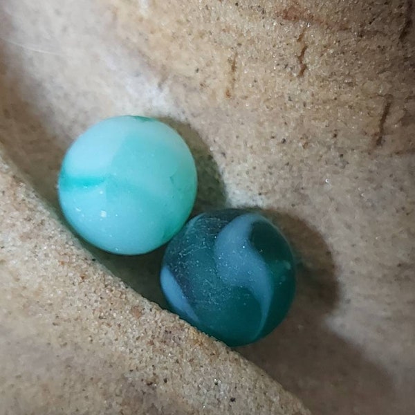 2 beautifully weathered greenish teal colored Sea Glass marbles perfectly weathered by the ocean found on the bay of fundy beaches