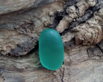 Teal bluish green Seaglass marble cane. This must have been a dudd due to one flat side and stretched out shape! Such a unique piece.