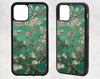 Puede incluir: Tres fundas de teléfono negras con un diseño floral verde y blanco. El diseño presenta un patrón repetitivo de ramas con flores blancas.