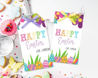 May include: Two colorful Happy Easter gift tags with a floral design and pastel colored eggs. The tags have a white background with the text "Happy Easter" in rainbow letters and "Love, Cameron" in purple letters.
