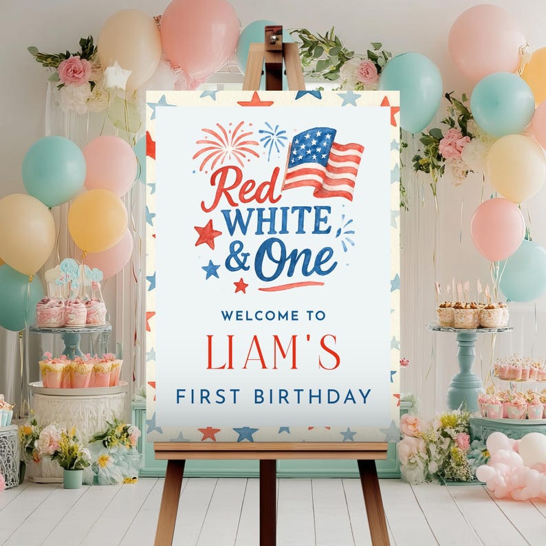 Puede incluir: Un letrero de fiesta en un caballete con el texto "Red, White & One" y "Liam's First Birthday" en rojo y azul. El letrero presenta una bandera estadounidense y gr&aacute;ficos de estrellas, rodeado de globos en colores pastel.