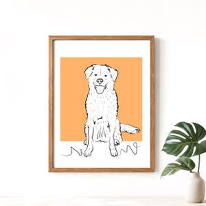 May include: A framed art print featuring a black and white line drawing of a dog sitting with its tongue out. The dog is set against an orange background. The artwork is in a wooden frame and is displayed on a white surface.
