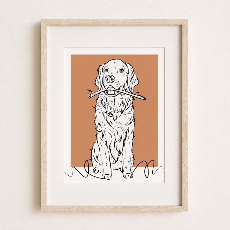 Puede incluir: Una l&aacute;mina de arte enmarcada con un dibujo lineal en blanco y negro de un perro golden retriever que sostiene un palo en la boca. El perro est&aacute; centrado sobre un fondo rectangular de color terracota con una l&iacute;nea negra simple en la base.
