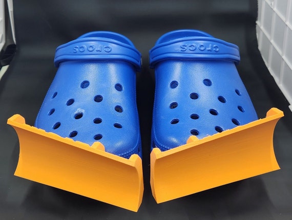 These Croc Snow Plow Attachments Help You Wear Your Crocs Through