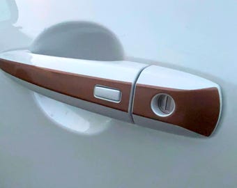 Metalen strepen op de portiergrepen voor de Nissan Rogue S-, SV-, SL-, Midnight-, Platinum- en Rock Creek-modellen 2021-26. Inclusief Smart Key-uitsparing!